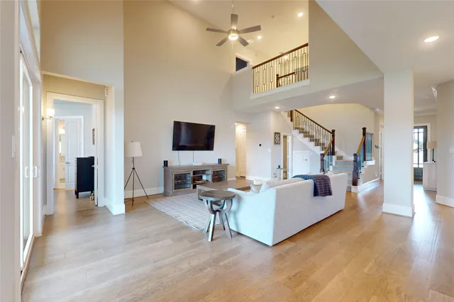 a living room with fireplace furniture and a flat screen tv
