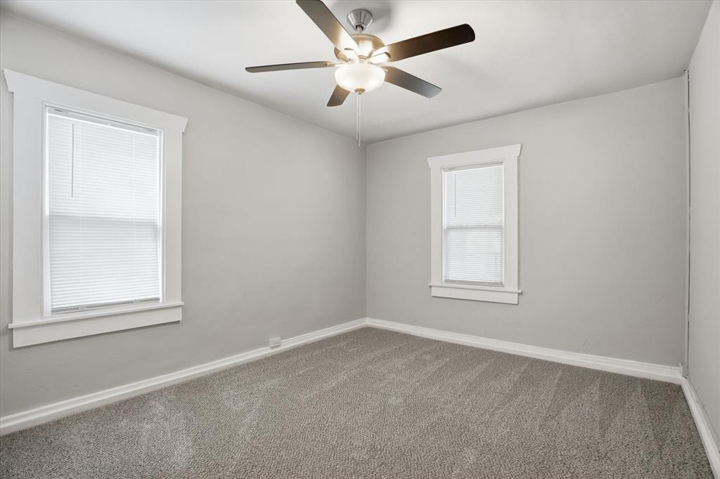 711 Roberts Cut Off Road River Oaks, TX 76114 - Photo 12 of 21 an empty room with a window and a fan
