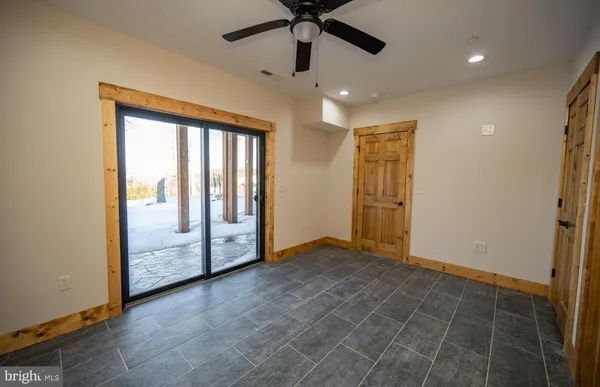 a bathroom with a granite countertop sink a mirror and a shower