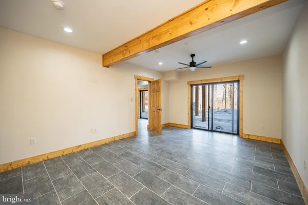 a view of a porch with a floor to ceiling window