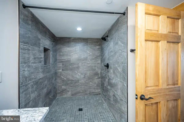 a view of a backyard of a house with a yard