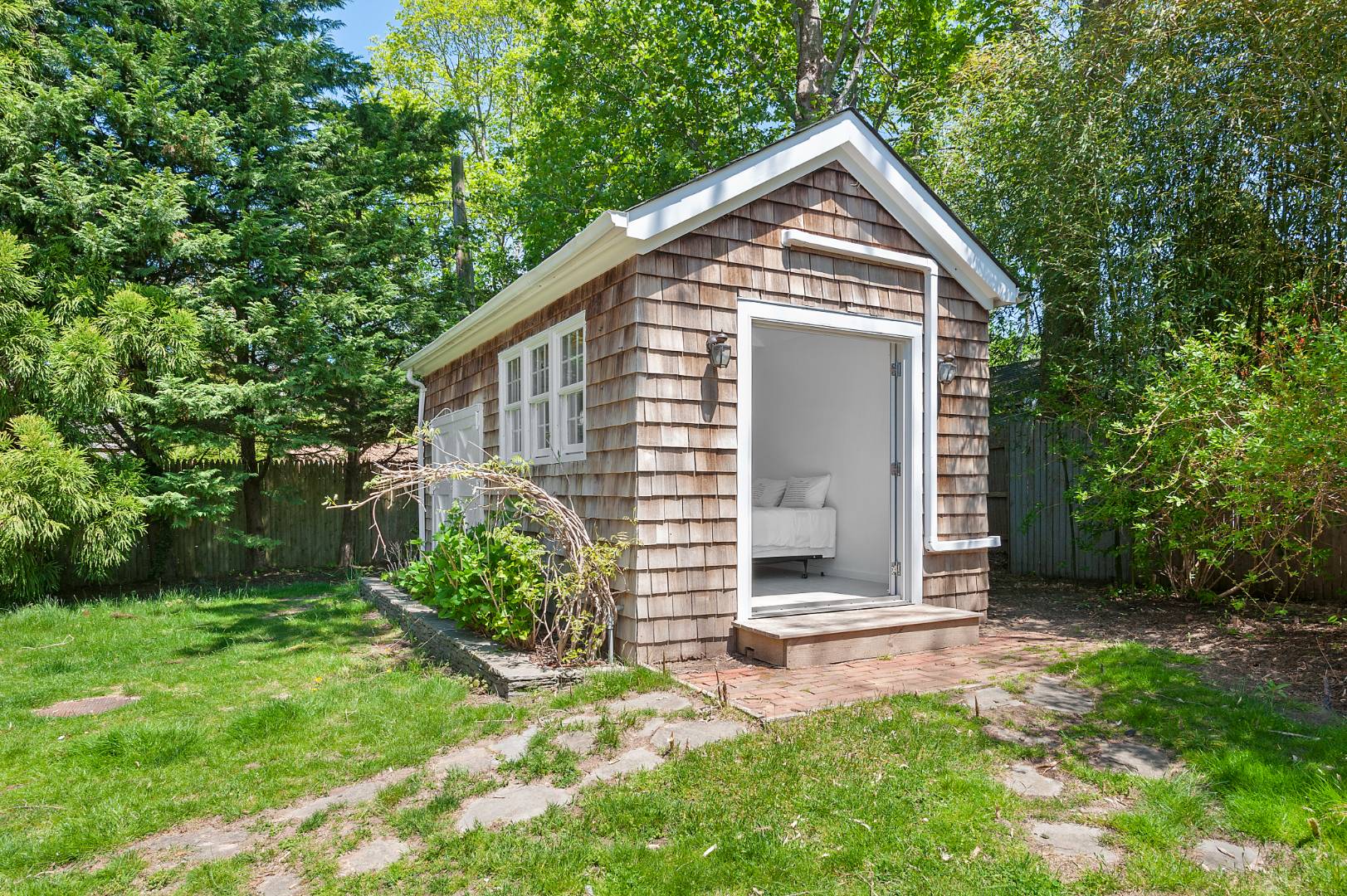 5 Willow Lane East Hampton, NY 11937 - Photo 8 of 9 a front view of a house with garden