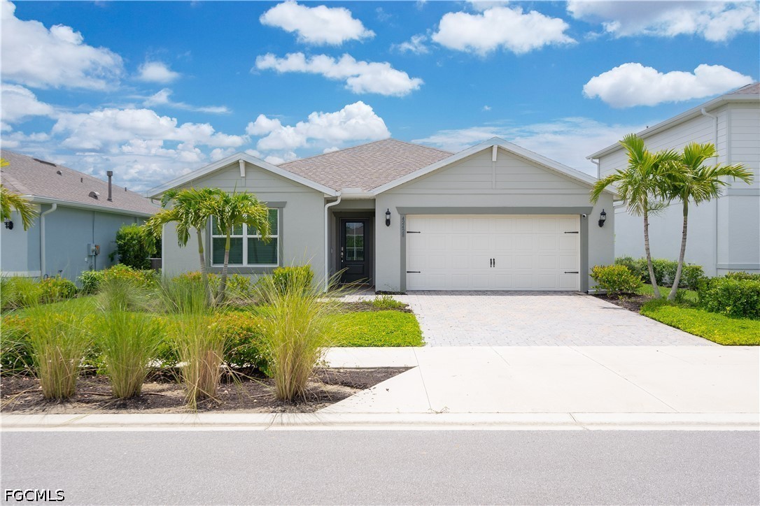 42428 Cascade Drive Punta Gorda, FL 33982 - Photo 1 of 47 a front view of a house with garden