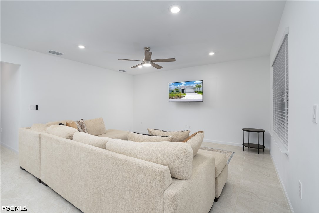 42428 Cascade Drive Punta Gorda, FL 33982 - Photo 11 of 47 a living room with furniture and a view of kitchen