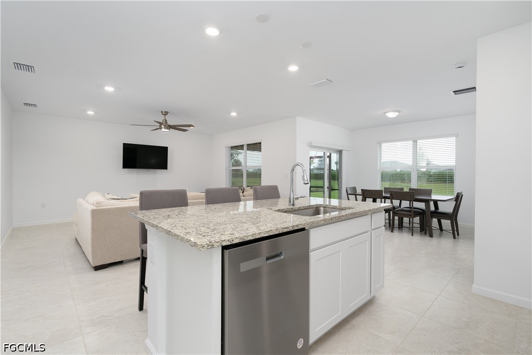 42428 Cascade Drive Punta Gorda, FL 33982 - Photo 3 of 47 a room with furniture and a view of kitchen