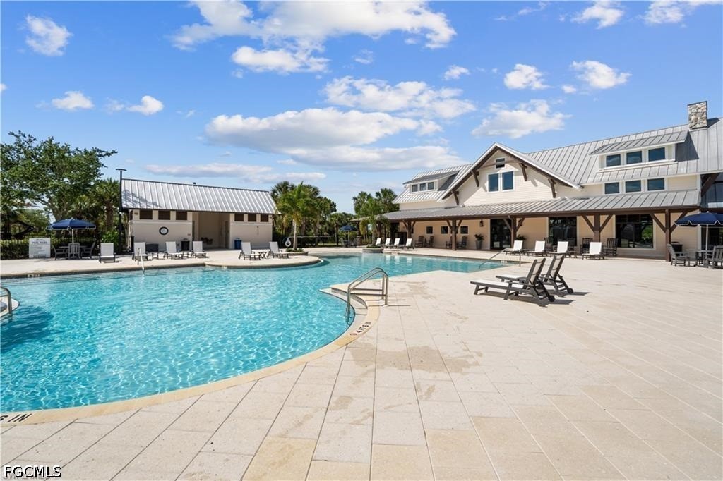 42428 Cascade Drive Punta Gorda, FL 33982 - Photo 38 of 47 a swimming pool with outdoor seating and yard