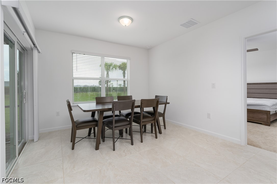 42428 Cascade Drive Punta Gorda, FL 33982 - Photo 7 of 47 a view of a dining room with furniture and window