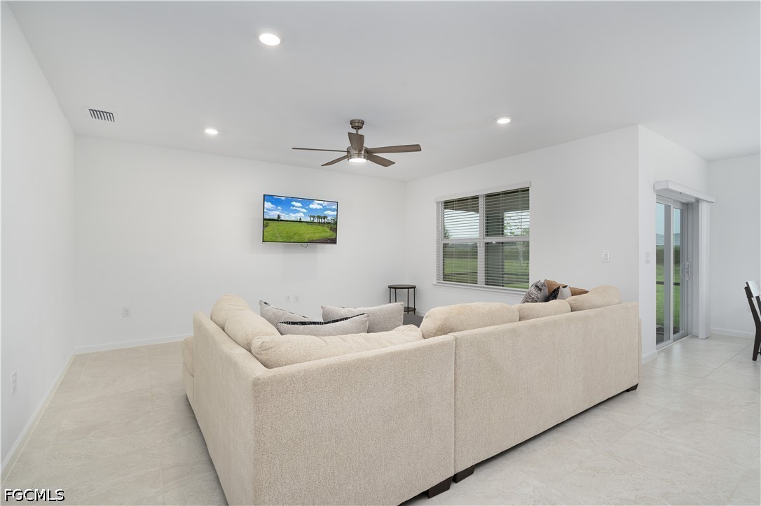 42428 Cascade Drive Punta Gorda, FL 33982 - Photo 10 of 47 a living room with furniture and a ceiling fan