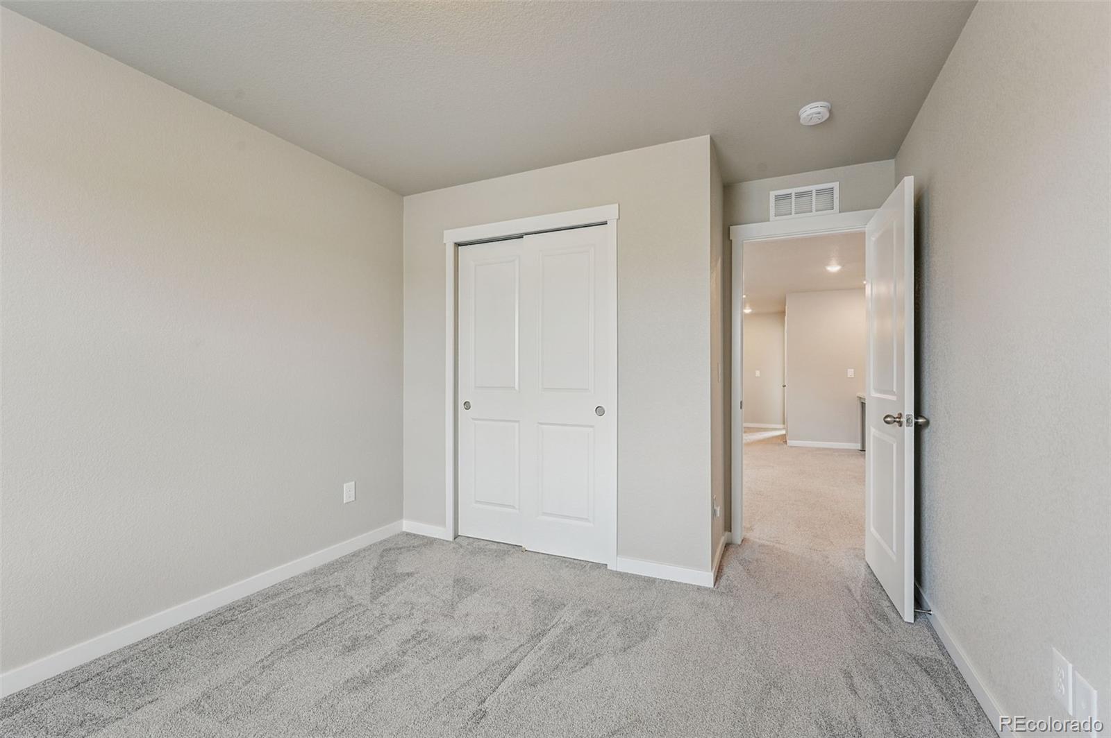 8206 Turtle Lake Way Colorado Springs, CO 80925 - Photo 17 of 27 a view of an empty room and closet area