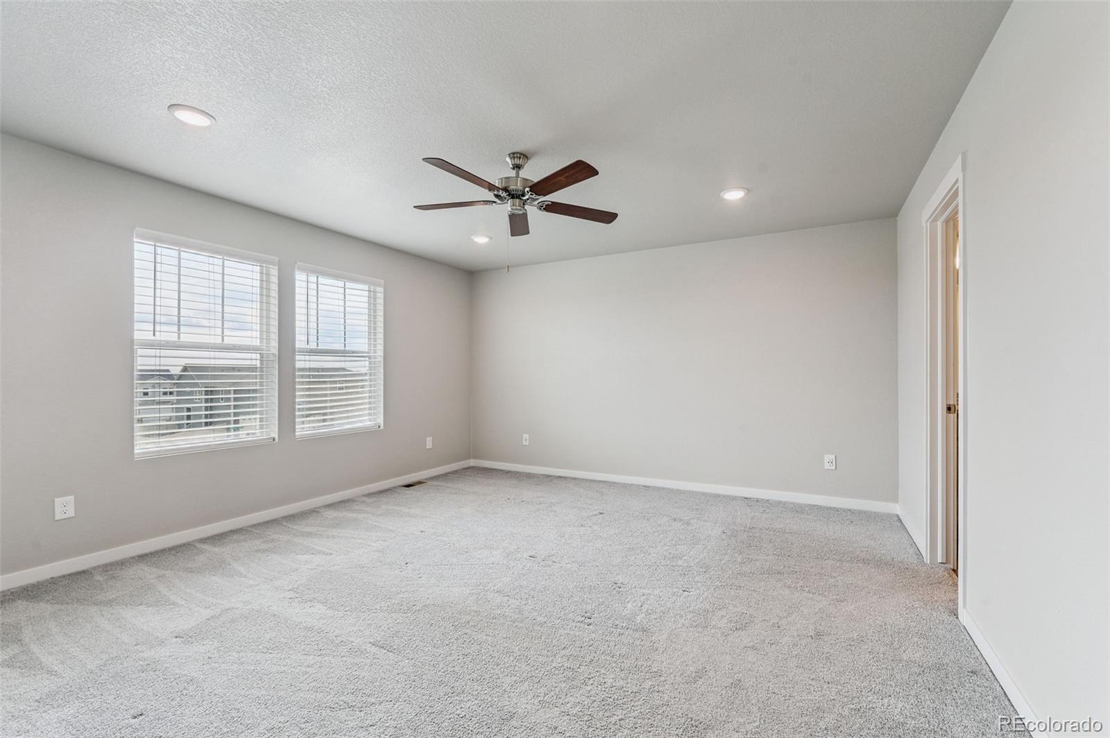 8206 Turtle Lake Way Colorado Springs, CO 80925 - Photo 18 of 27 a view of an empty room with a window