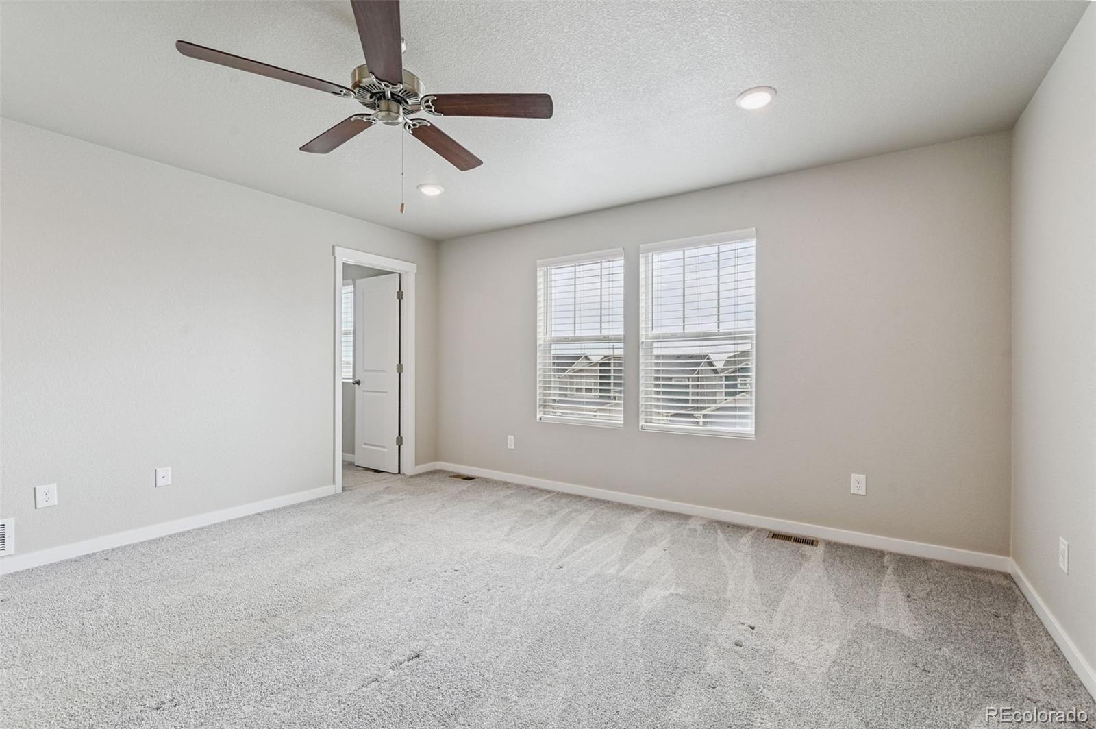 8206 Turtle Lake Way Colorado Springs, CO 80925 - Photo 19 of 27 a view of an empty room with a window
