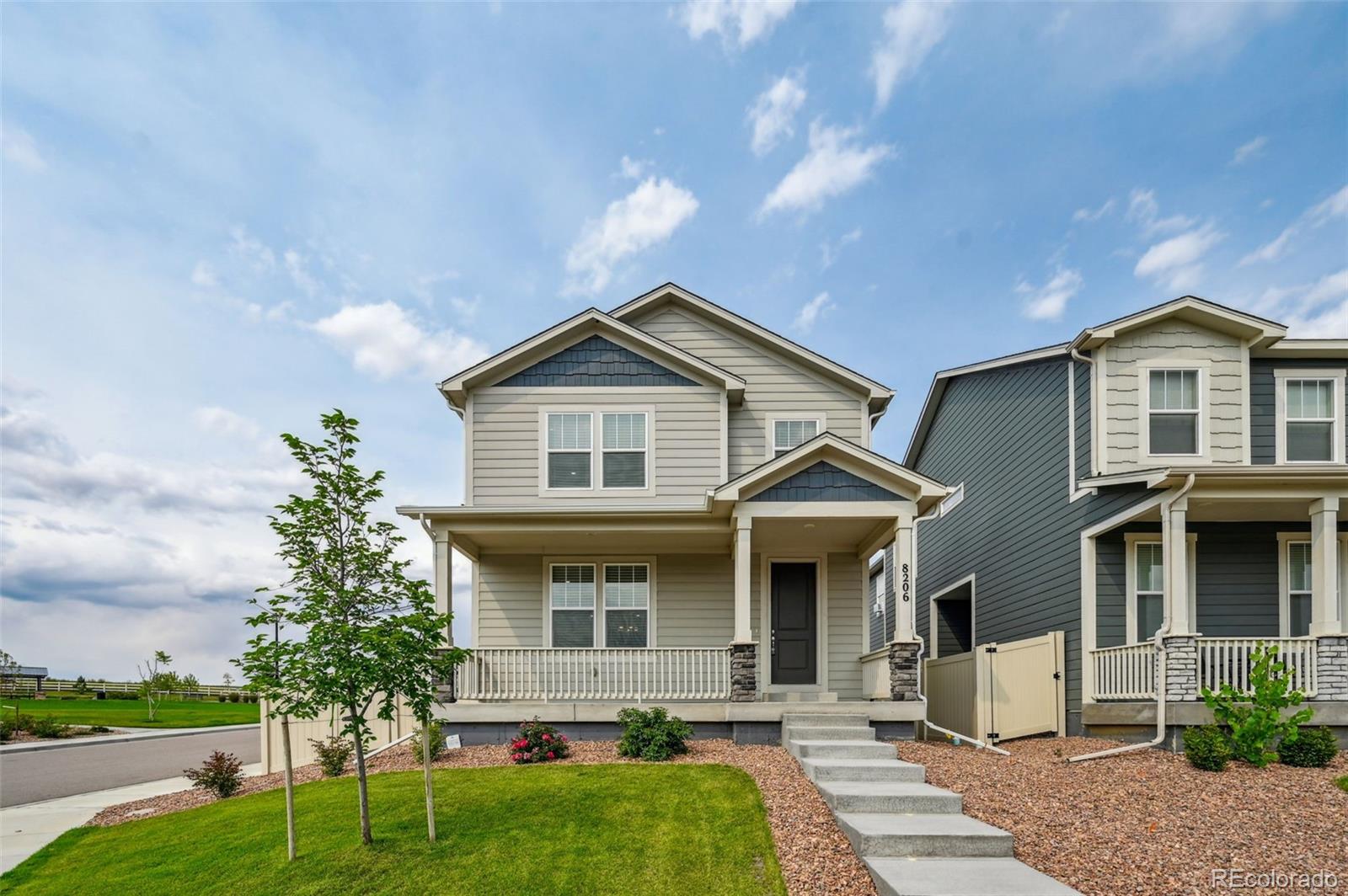 8206 Turtle Lake Way Colorado Springs, CO 80925 - Photo 2 of 27 a front view of a house with garden