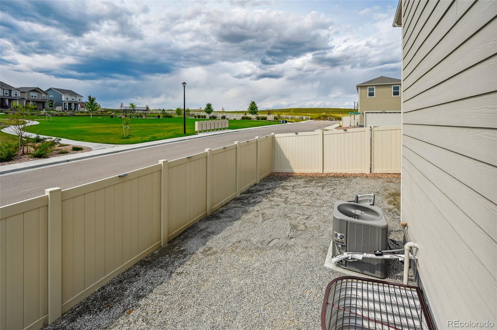 8206 Turtle Lake Way Colorado Springs, CO 80925 - Photo 25 of 27 a view of a terrace with yard