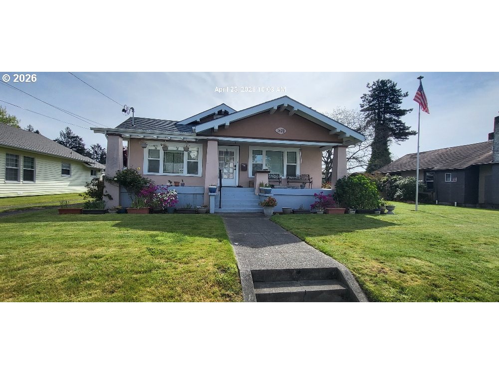 1439 Union Avenue North Bend, OR 97459 - Photo 1 of 23 a front view of a house with garden
