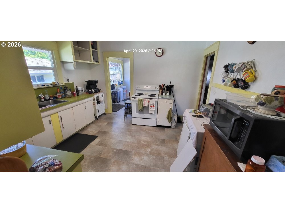 1439 Union Avenue North Bend, OR 97459 - Photo 20 of 23 a kitchen with sink cabinets and appliances