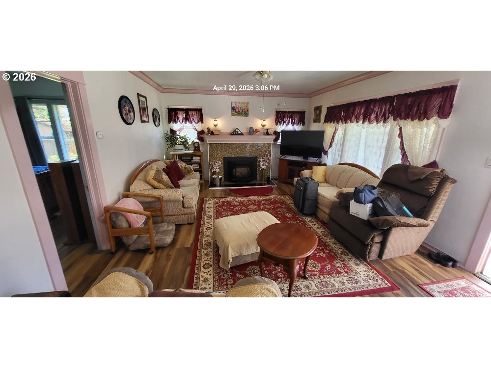 1439 Union Avenue North Bend, OR 97459 - Photo 21 of 23 a living room with furniture and a fireplace