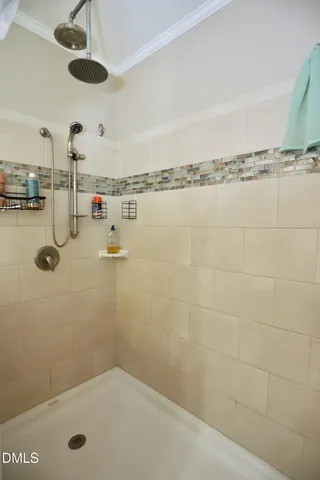 a bathroom with a tub and a shower