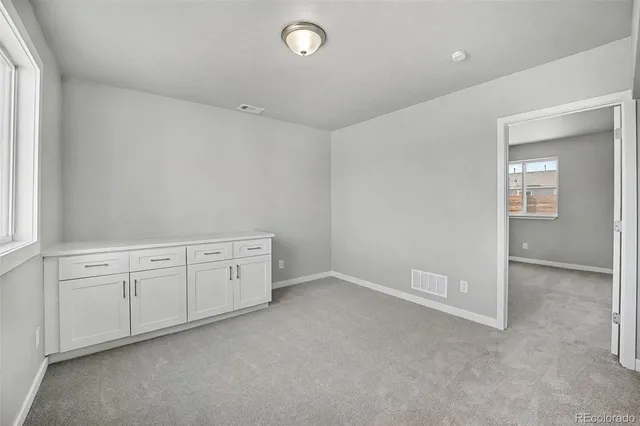 an empty room with windows