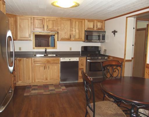 1313 Old Princeton Road New Castle, PA 16101 - Photo 3 of 18 Kitchen. Enjoy cooking in your updated Hickory kitchen. The beautiful corian counter tops makes it easy to clean up. Other features include the stainless steel appliances & a gorgeous laminate floor.