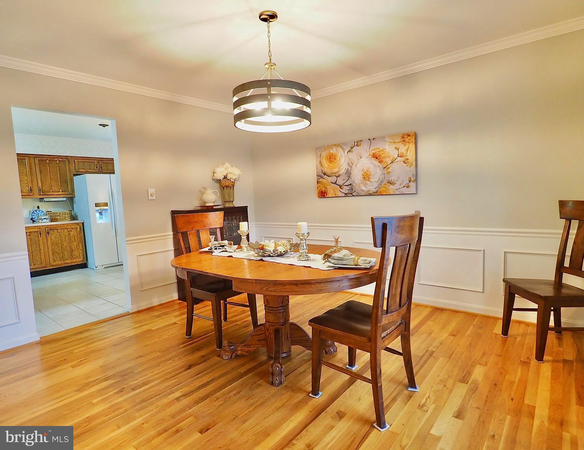 8614 Stonewall Road Manassas, VA 20110 - Photo 5 of 39 Formal dining room with new chandelier