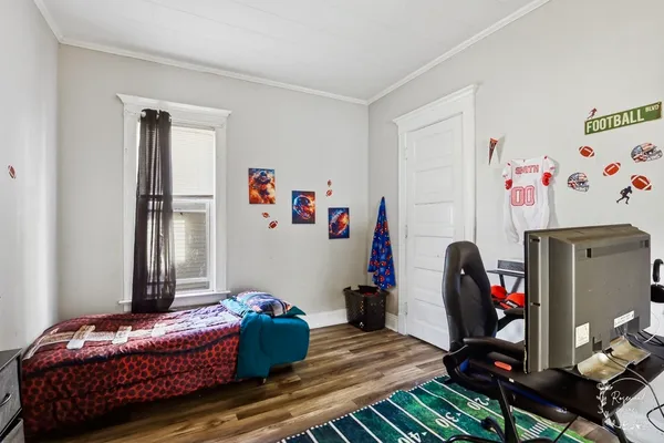 a bedroom with furniture and a bed