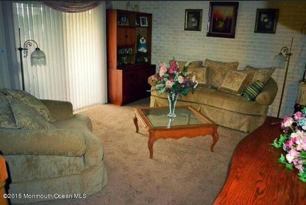 371 Aldrich Road Howell, NJ 07731 - Photo 8 of 15 a living room with furniture and flowers