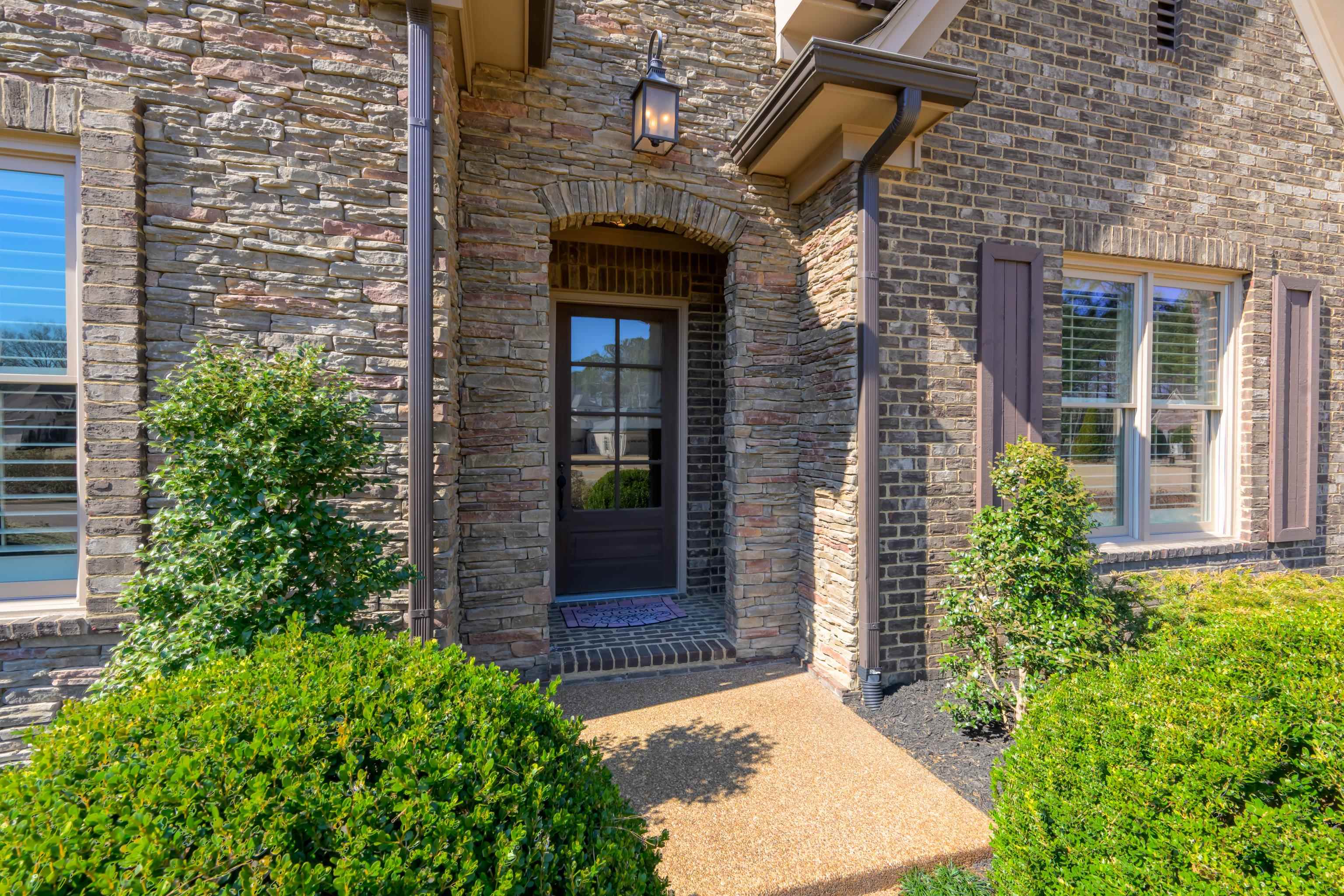 25 Riversedge Cove North Arlington, TN 38002 - Photo 28 of 40 front view of a brick house with a large window