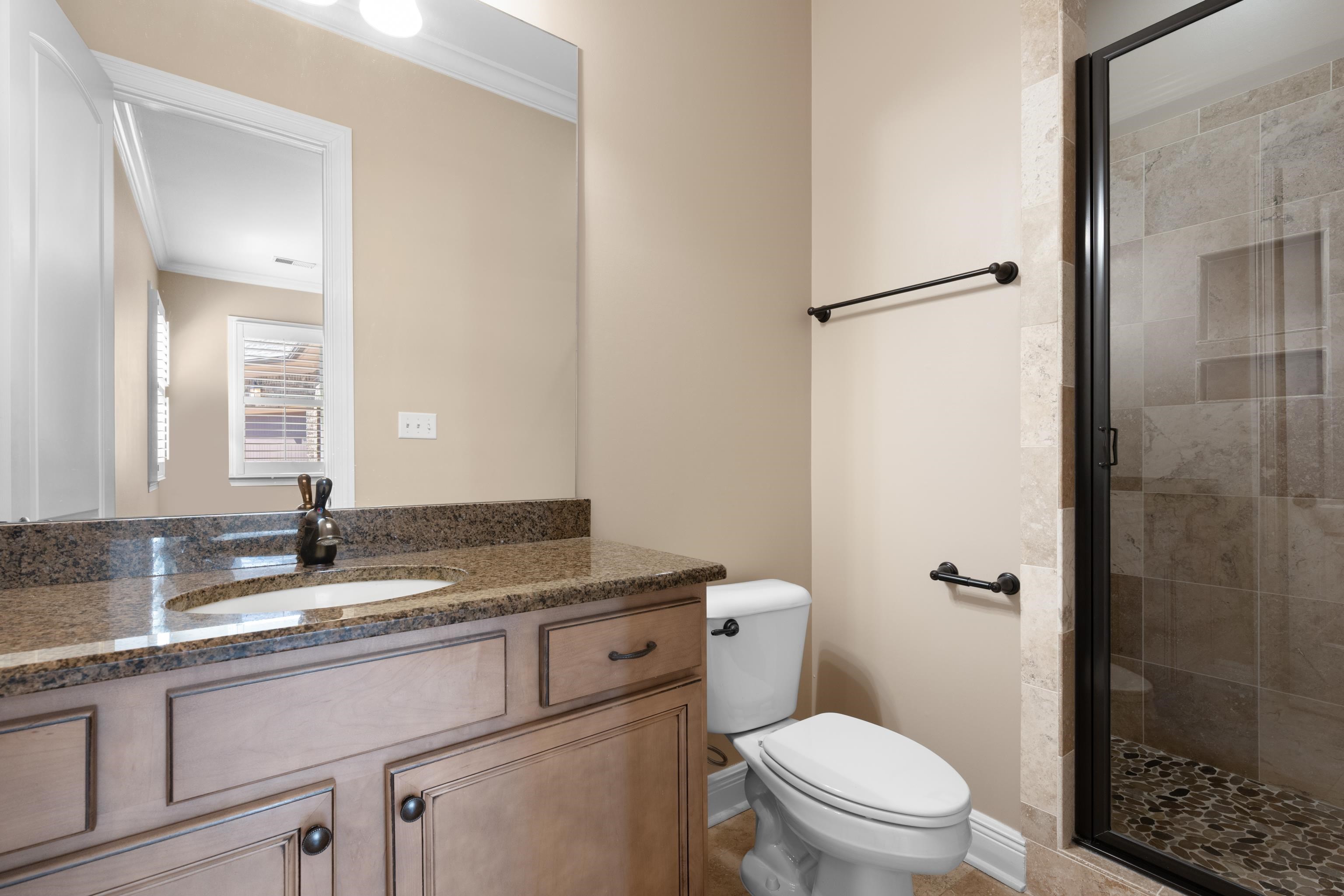 25 Riversedge Cove North Arlington, TN 38002 - Photo 10 of 40 a bathroom with a granite countertop sink toilet and shower