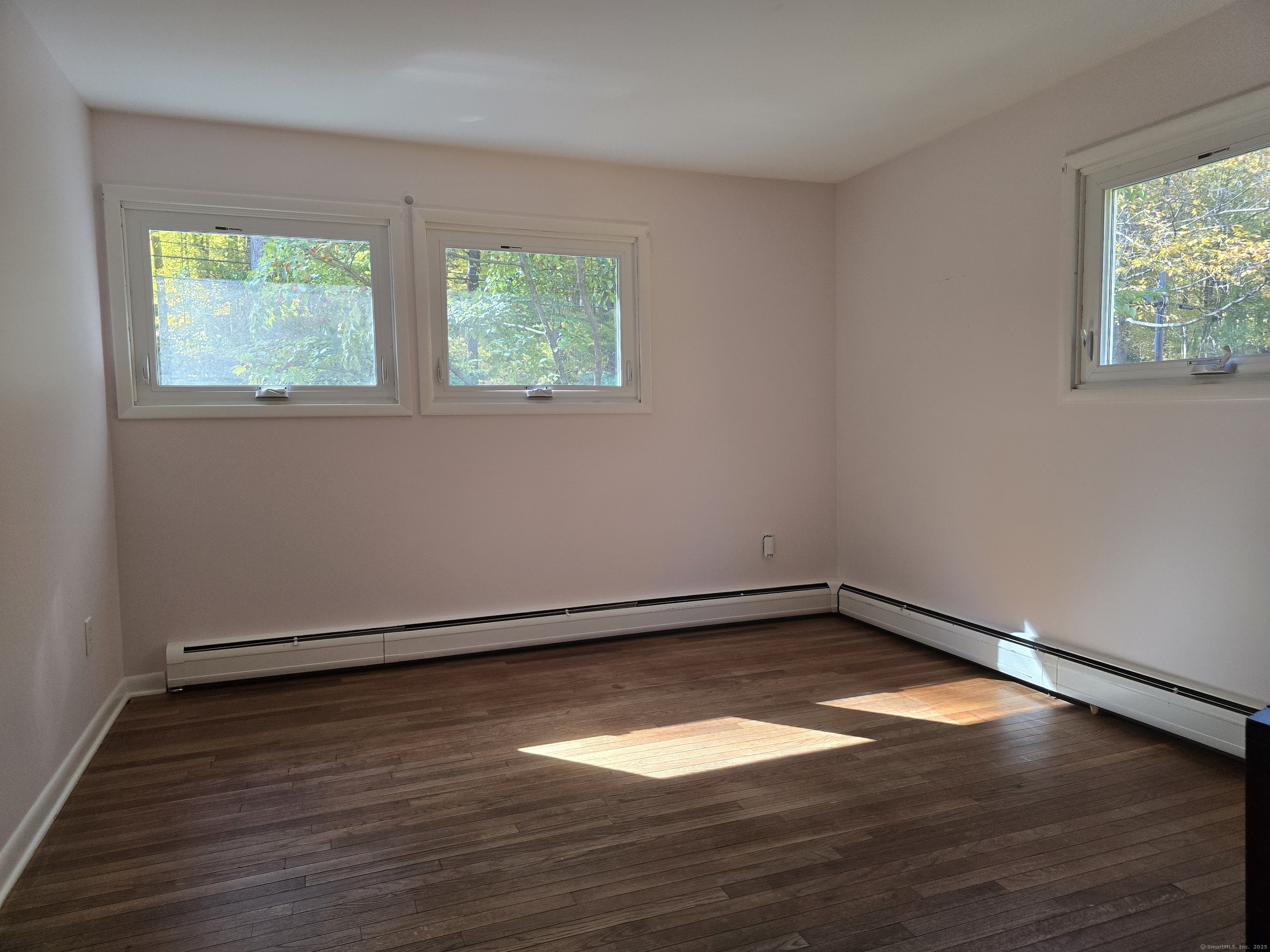 32 Old Green Road Newtown, CT 06482 - Photo 16 of 29 an empty room with wooden floor and windows