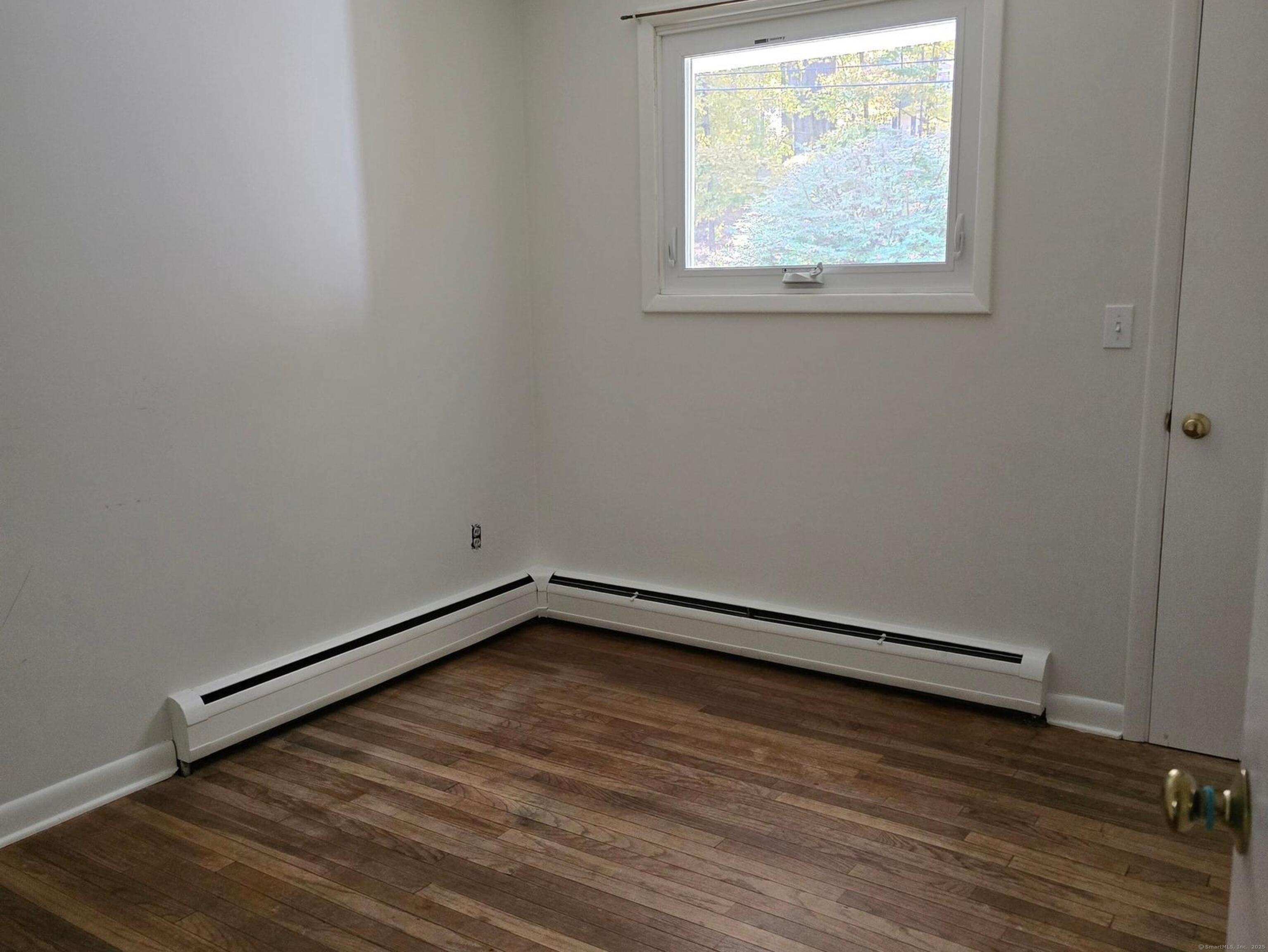 32 Old Green Road Newtown, CT 06482 - Photo 19 of 29 a view of a room with wooden floor and window