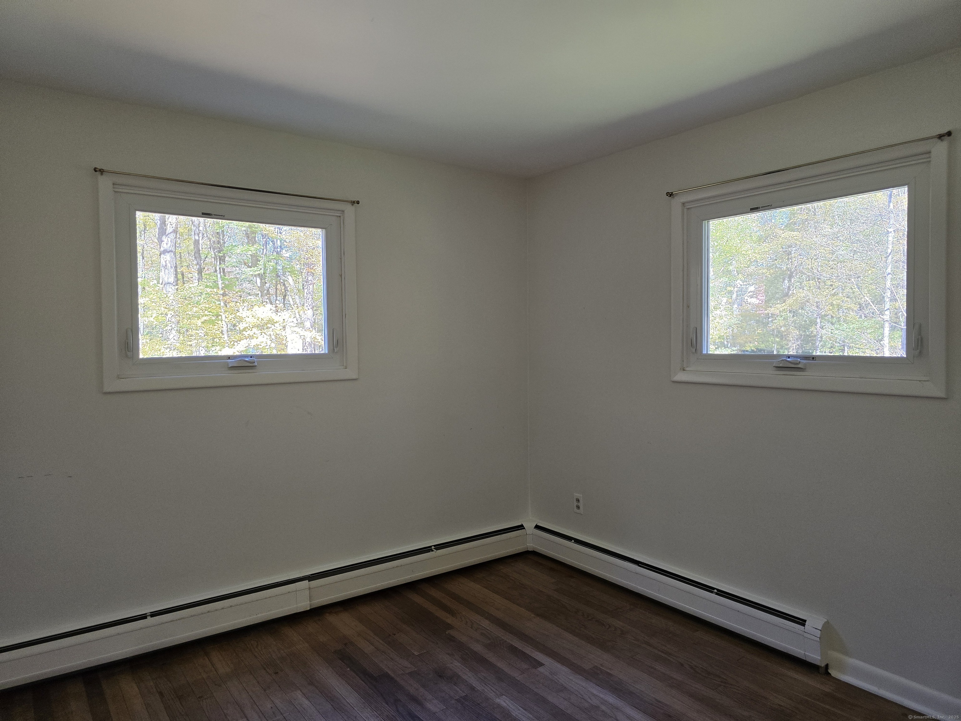 32 Old Green Road Newtown, CT 06482 - Photo 20 of 29 an empty room with wooden floor and windows