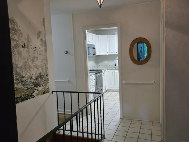 a view of a hallway with windows