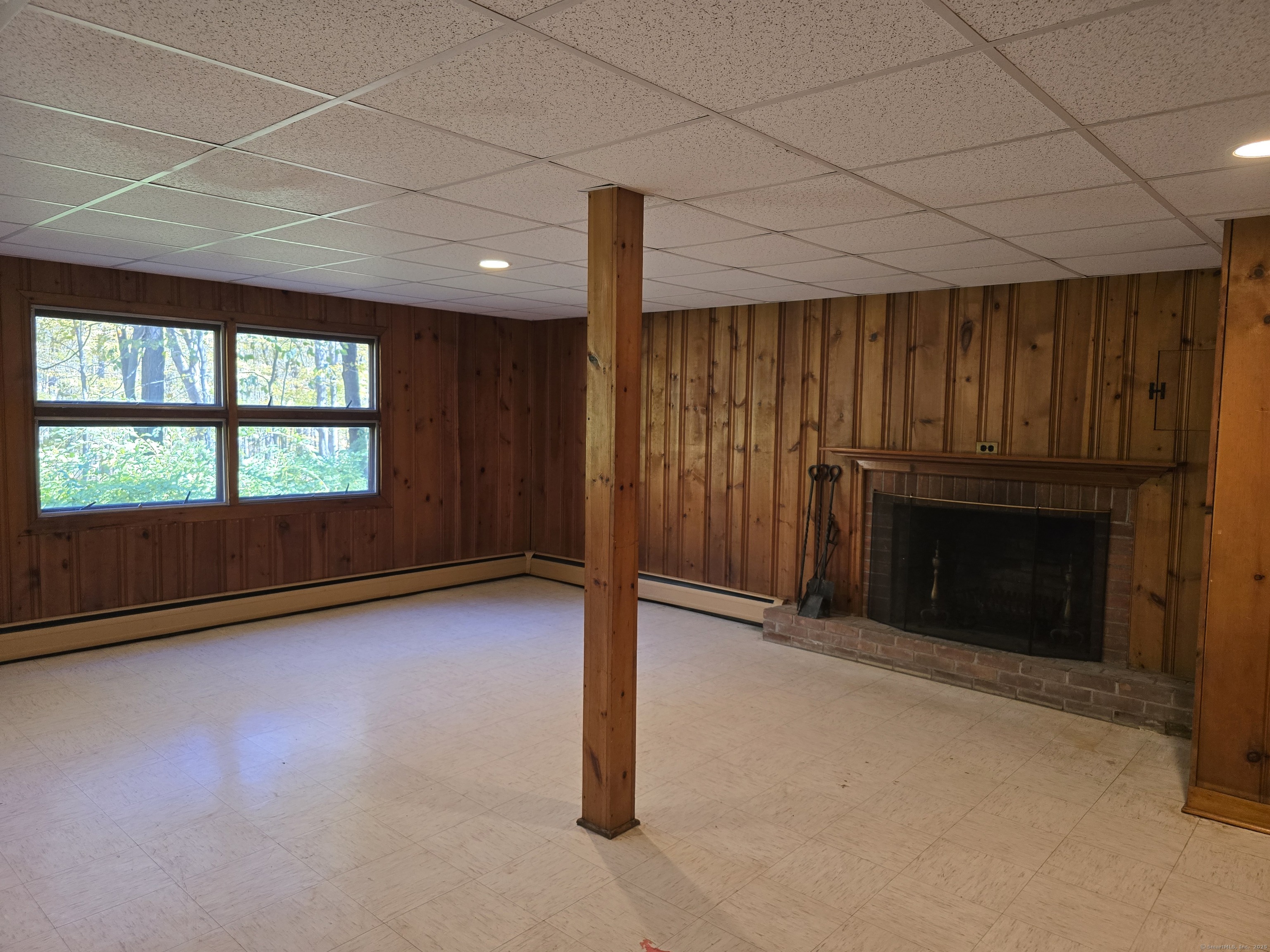 32 Old Green Road Newtown, CT 06482 - Photo 28 of 29 an empty room with windows fire place and fireplace