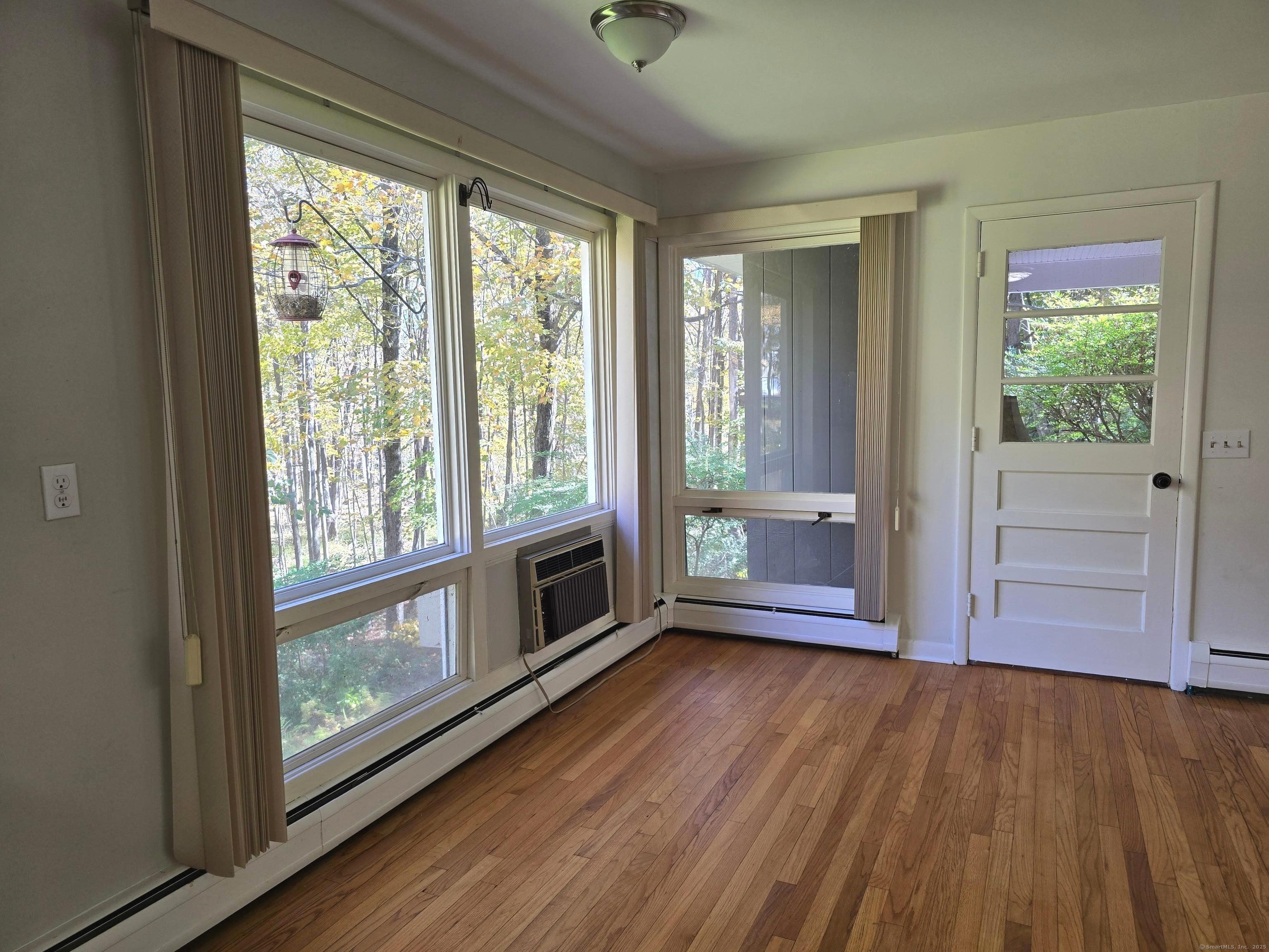 32 Old Green Road Newtown, CT 06482 - Photo 10 of 29 a view of empty room with wooden floor and fan