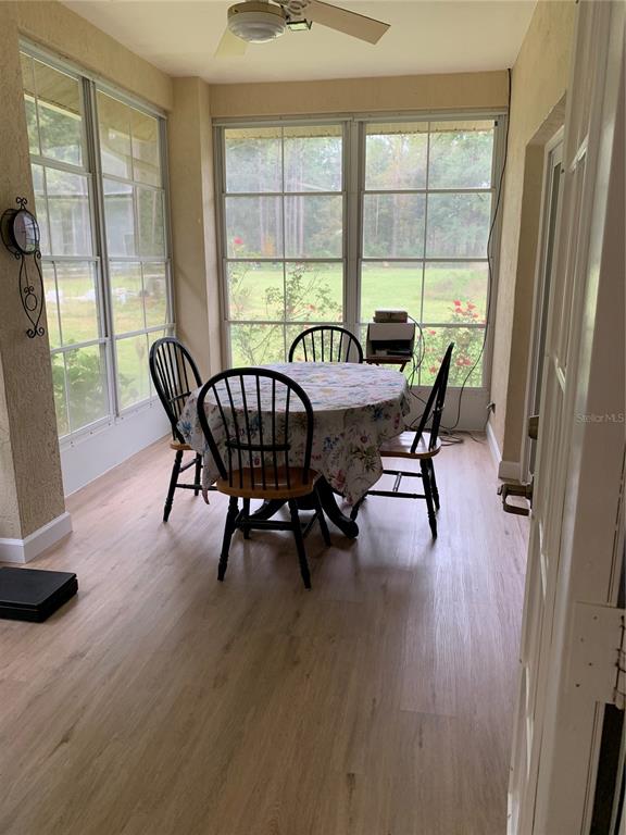 11636 Southwest 75th Circle Ocala, FL 34476 - Photo 14 of 38 a view of a dining room with furniture window and outside view