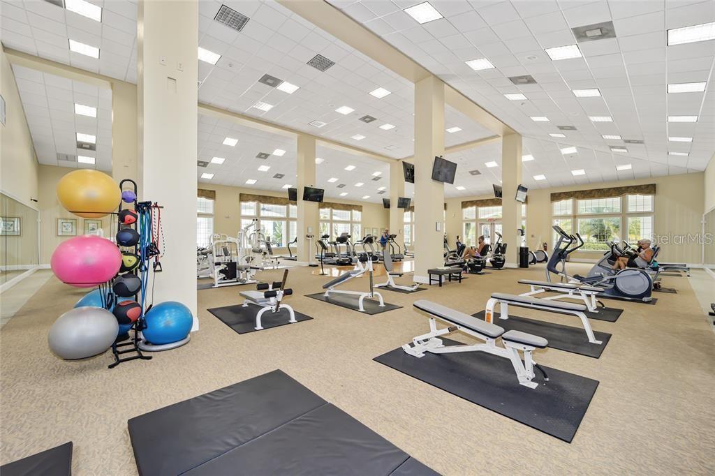 11636 Southwest 75th Circle Ocala, FL 34476 - Photo 37 of 38 a room with lots of gym equipment