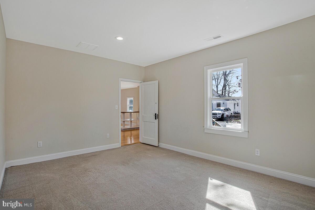 1916 Ridgeville Road Edgewater, MD 21037 - Photo 12 of 27 an empty room with windows and closet