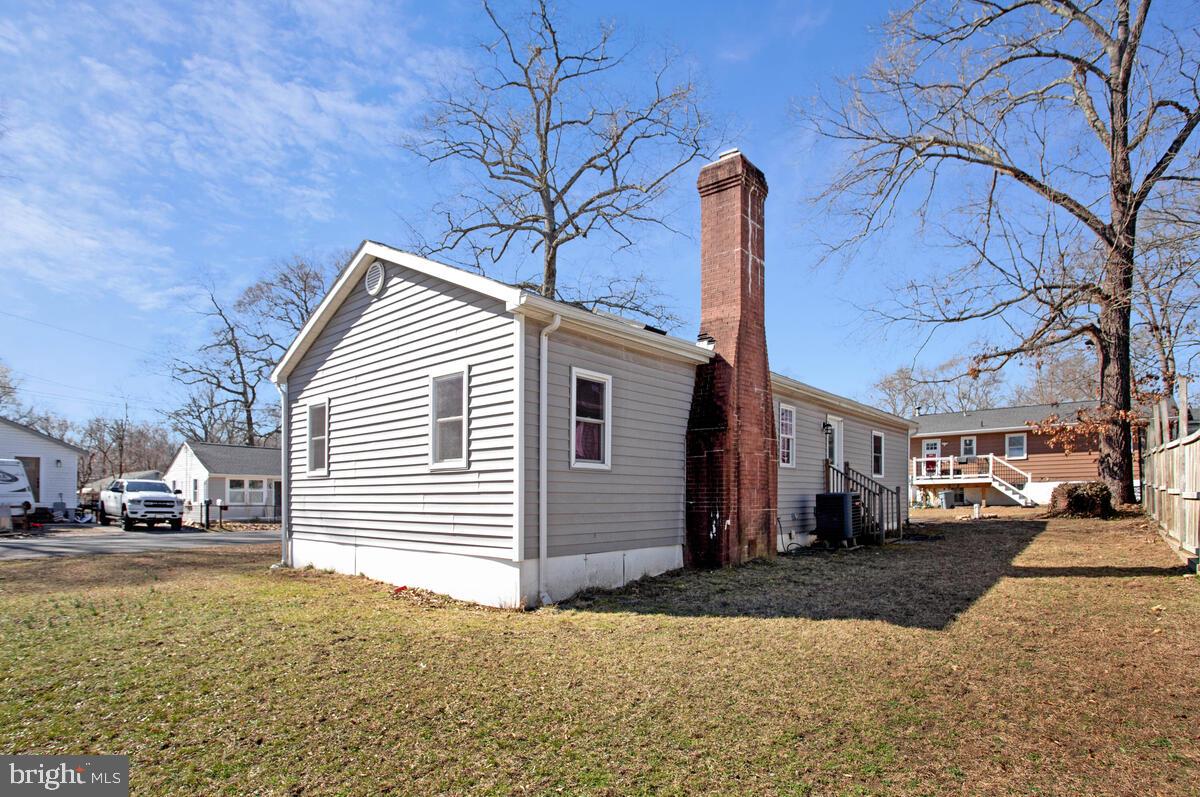 1916 Ridgeville Road Edgewater, MD 21037 - Photo 20 of 27 a front view of a house with a yard
