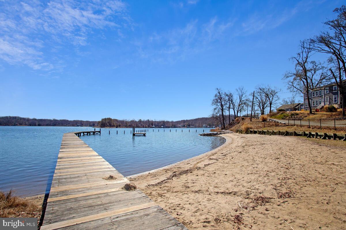 1916 Ridgeville Road Edgewater, MD 21037 - Photo 24 of 27 a view of a lake with a trees in the background