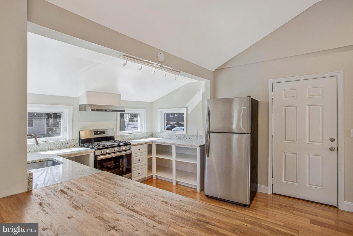 1916 Ridgeville Road Edgewater, MD 21037 - Photo 3 of 27 a kitchen with stainless steel appliances a refrigerator and a stove top oven
