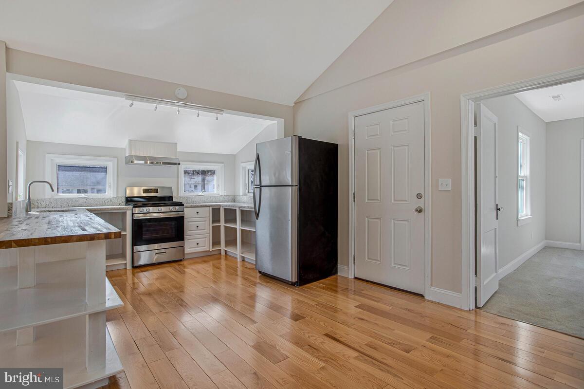 1916 Ridgeville Road Edgewater, MD 21037 - Photo 4 of 27 a kitchen with stainless steel appliances granite countertop a refrigerator and a stove top oven