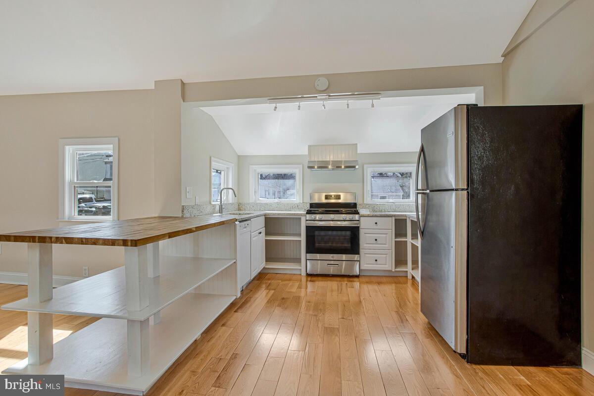 1916 Ridgeville Road Edgewater, MD 21037 - Photo 5 of 27 a kitchen with stainless steel appliances a refrigerator and a stove top oven