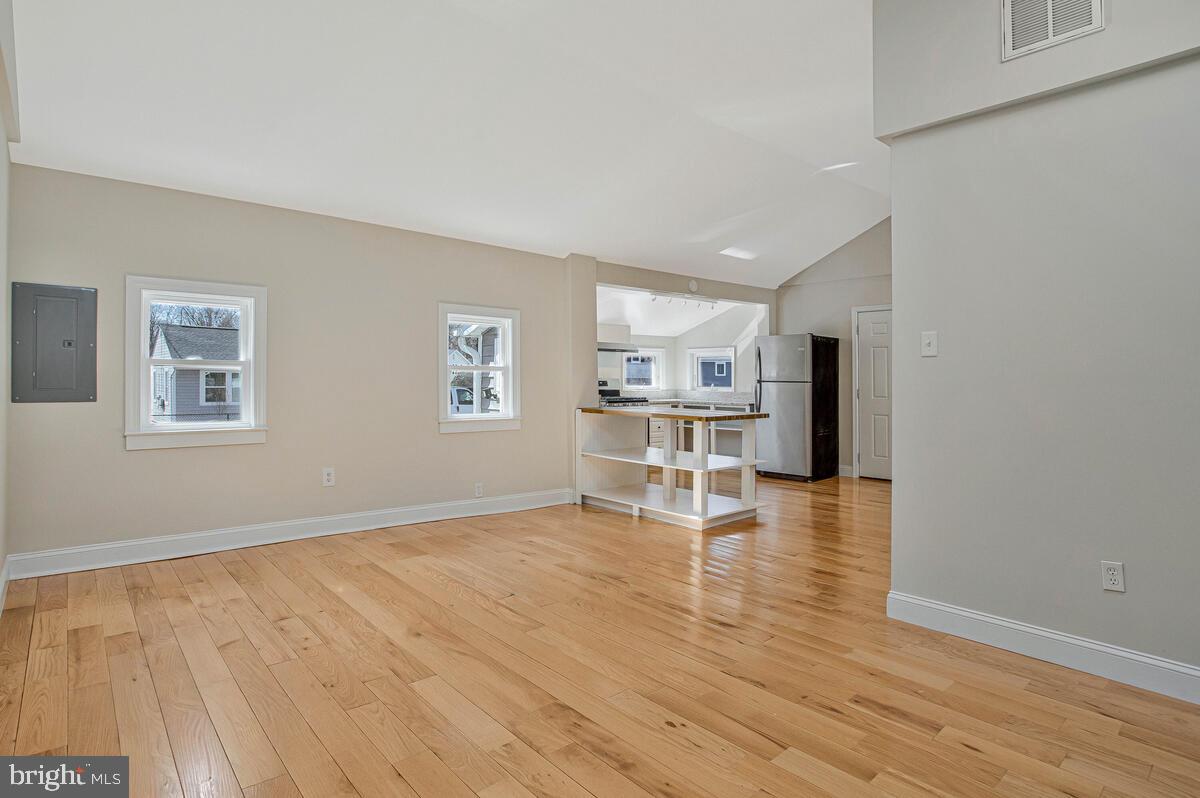 1916 Ridgeville Road Edgewater, MD 21037 - Photo 7 of 27 a view of empty room with wooden floor and windows