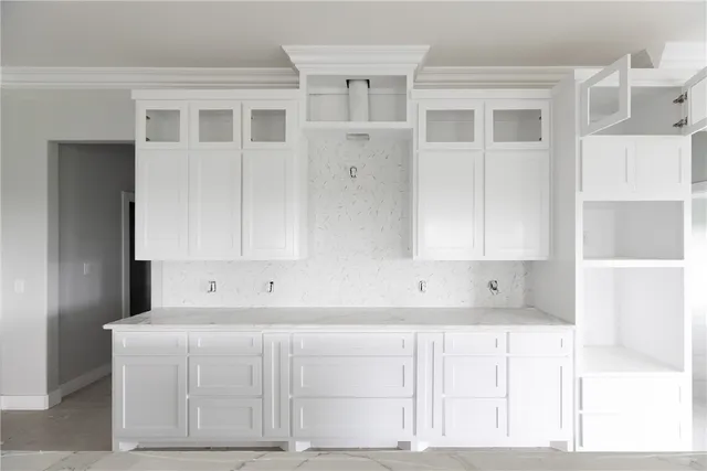 a view of kitchen with white cabinets