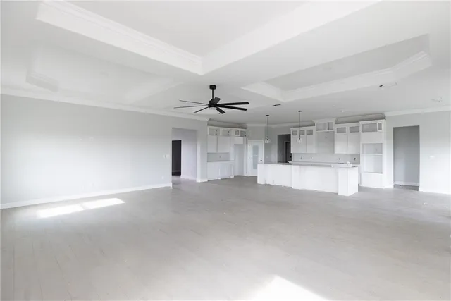 a view of a big room with closet and windows