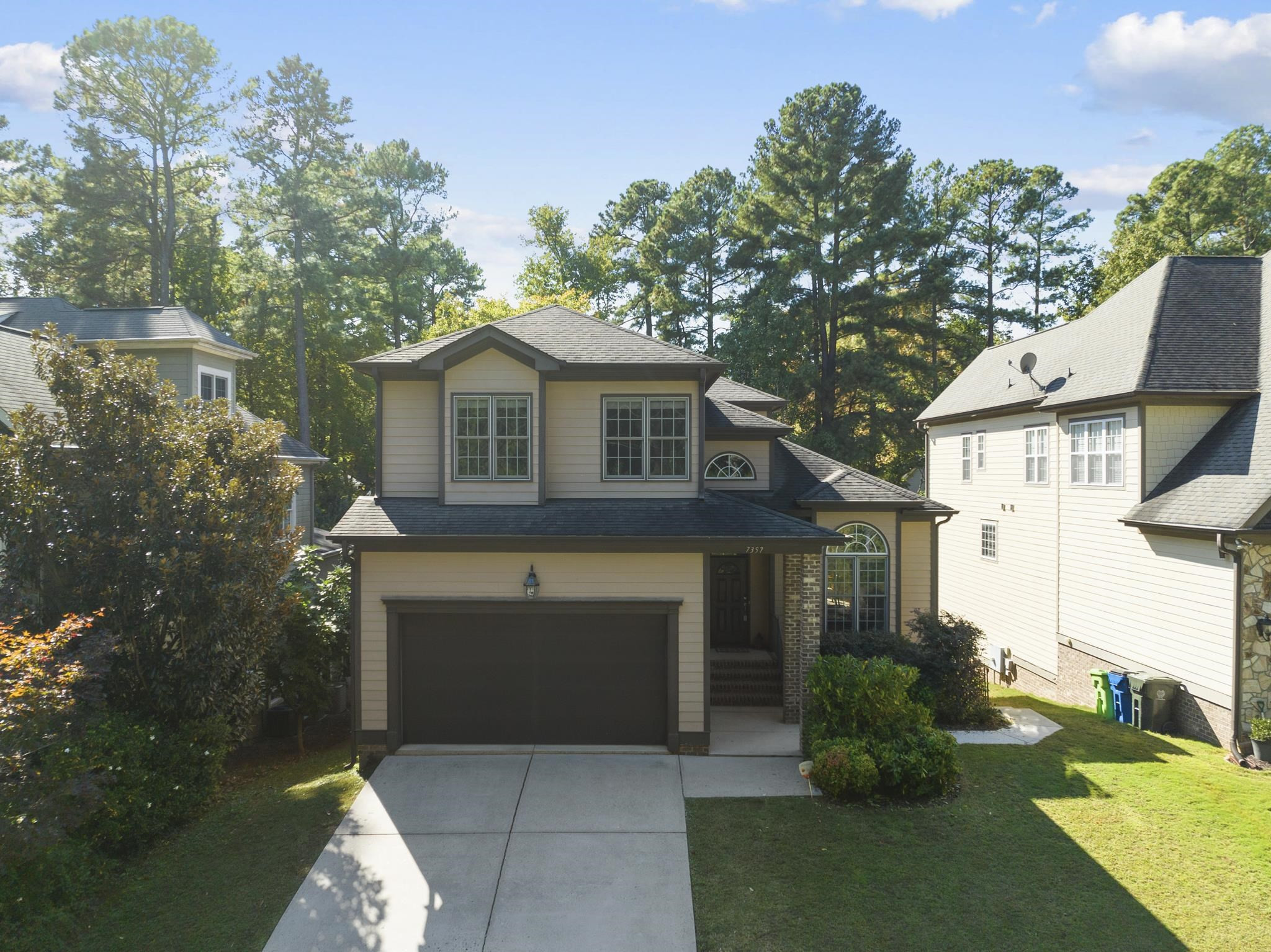 7357 Newport Avenue Raleigh, NC 27613 - Photo 1 of 44 a front view of a house with garden