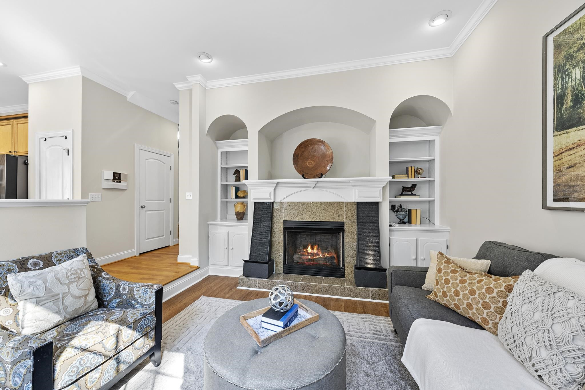7357 Newport Avenue Raleigh, NC 27613 - Photo 15 of 44 a living room with furniture and a fireplace