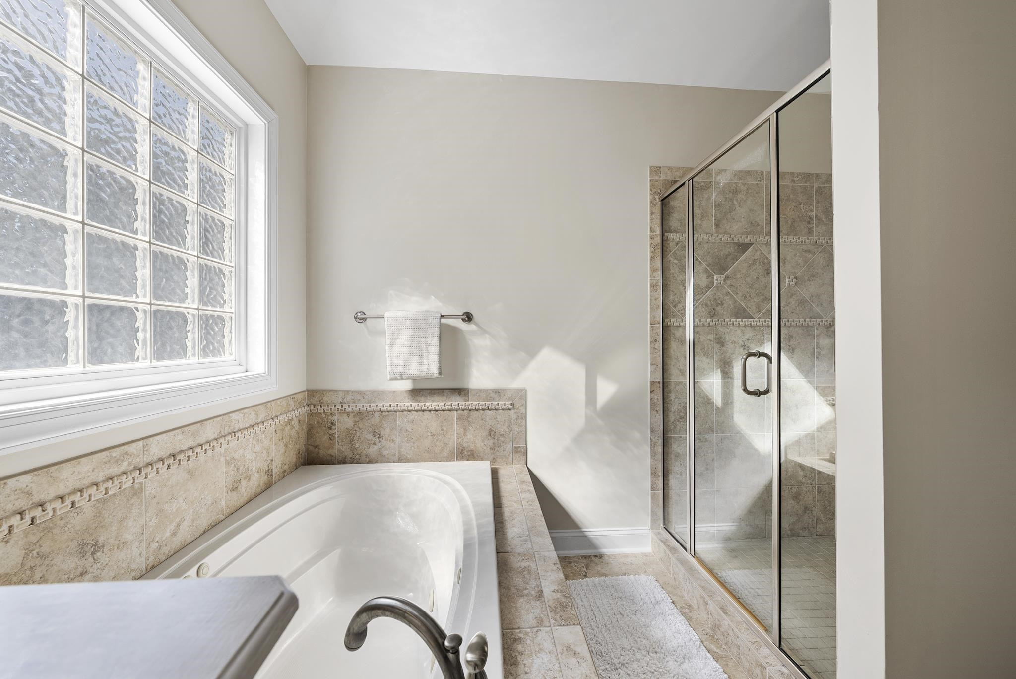 7357 Newport Avenue Raleigh, NC 27613 - Photo 20 of 44 a bath tub sitting next to a window