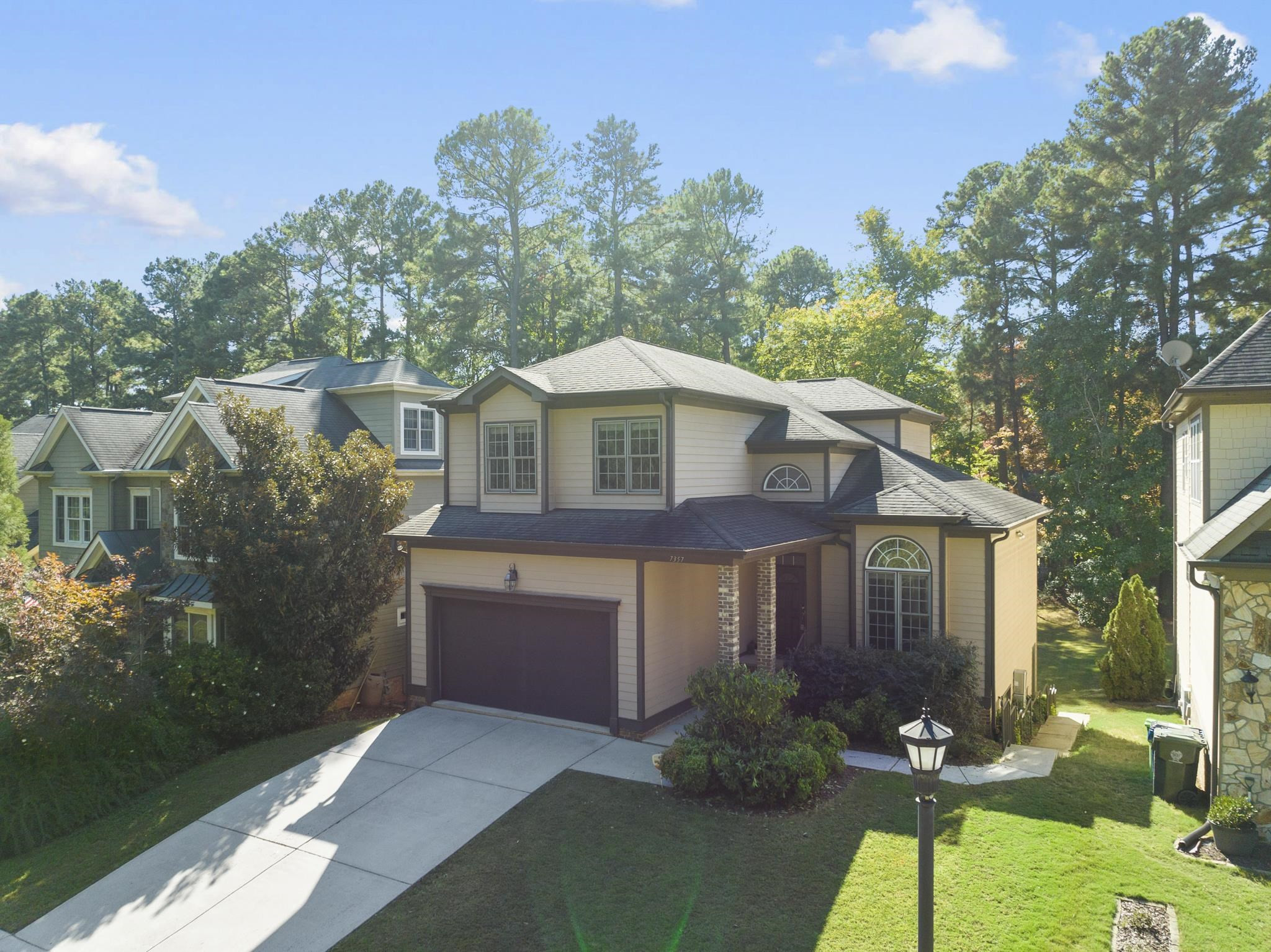 7357 Newport Avenue Raleigh, NC 27613 - Photo 2 of 44 a front view of a house with garden