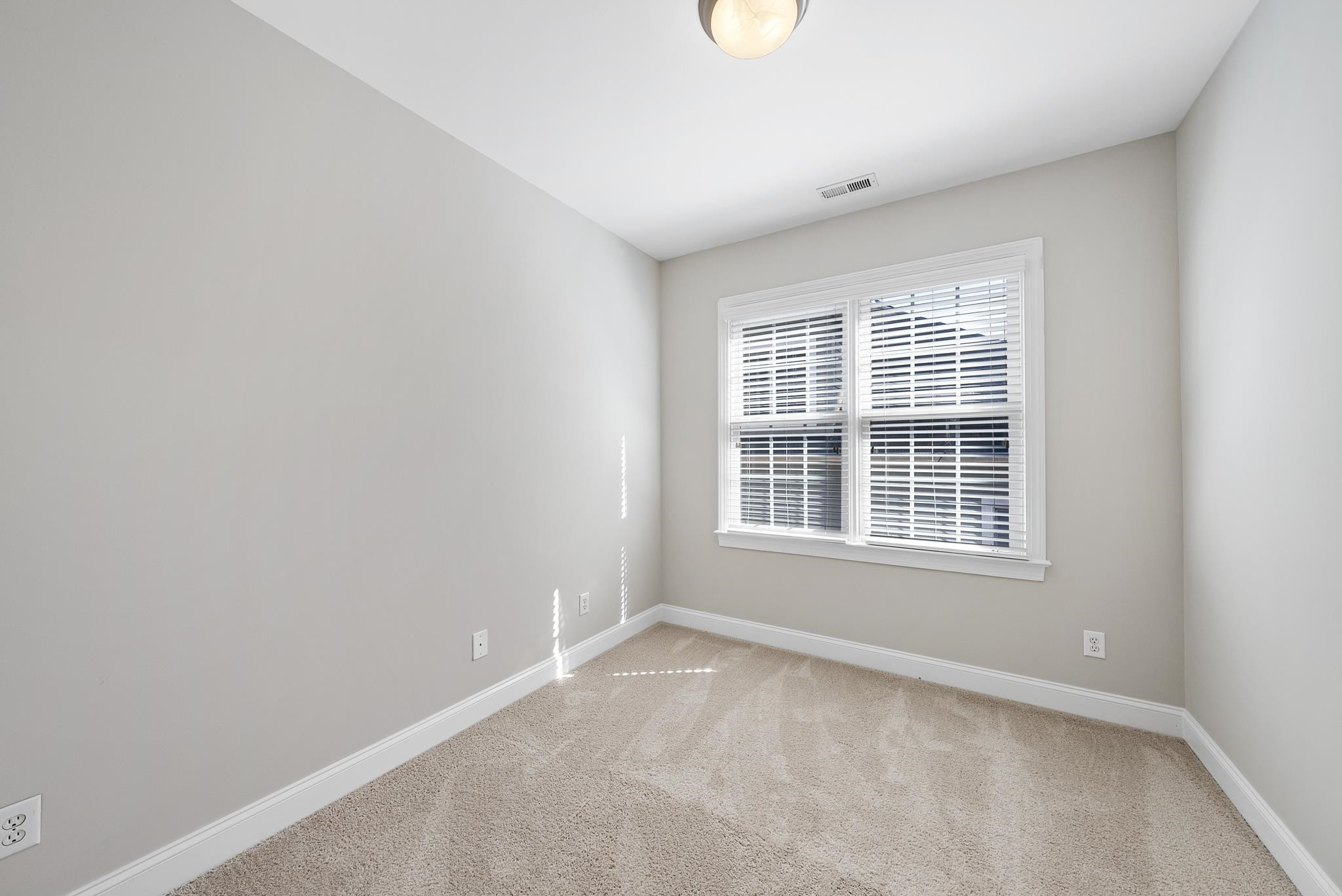 7357 Newport Avenue Raleigh, NC 27613 - Photo 22 of 44 an empty room with a window